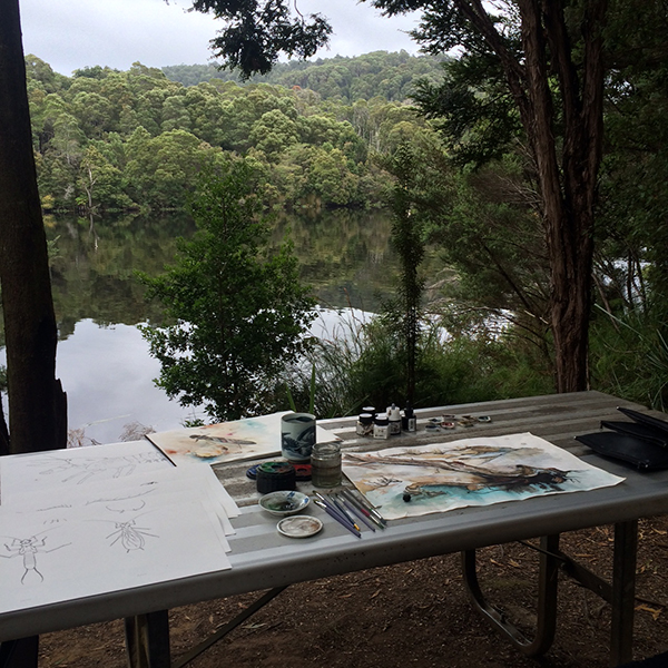 Artist table in outside location with river view