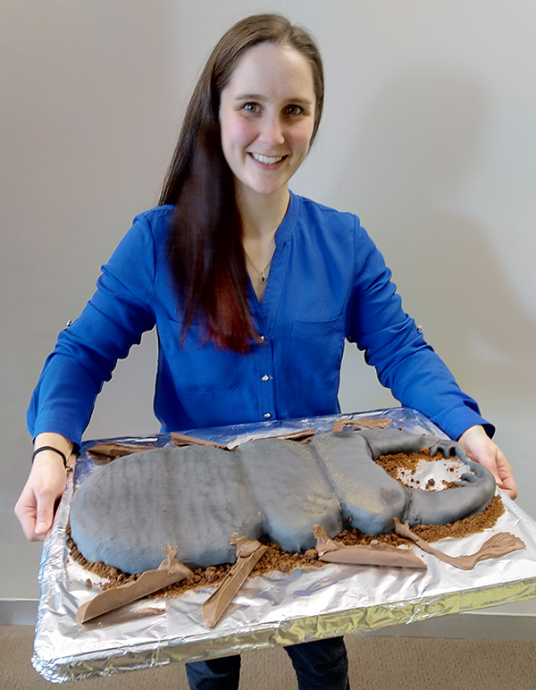 Woman holding a Stag Beetle cake