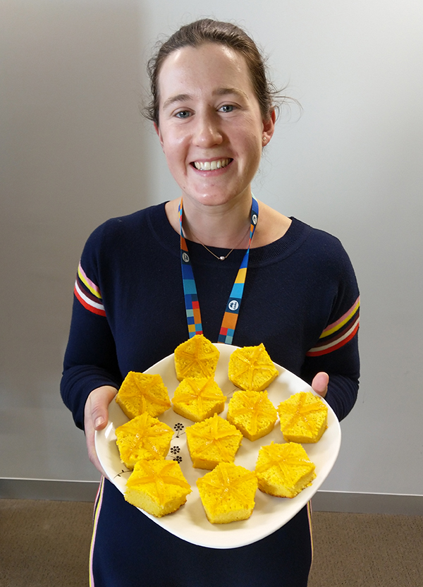 Woman holding plate of cakes inspired by Tasmanian live-bearing seastars