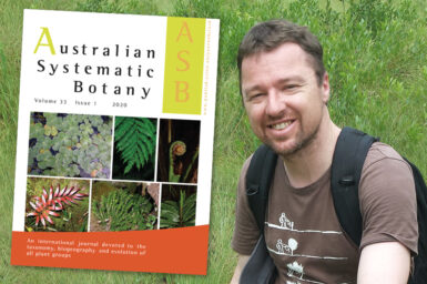 Dr Daniel Murphy standing in front of green grass with a superimposed image of the cover of Australian Systematic Botany next to him.