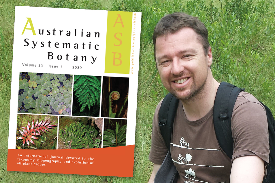 Dr Daniel Murphy standing in front of green grass with a superimposed image of the cover of Australian Systematic Botany next to him.
