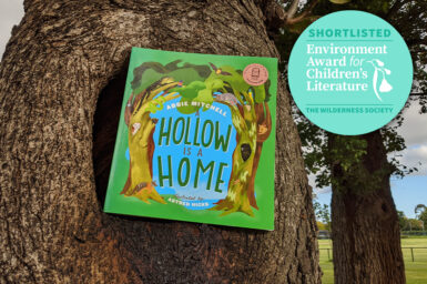 A Hollow is a Home book situated in a tree hollow with award logo placed in right hand corner
