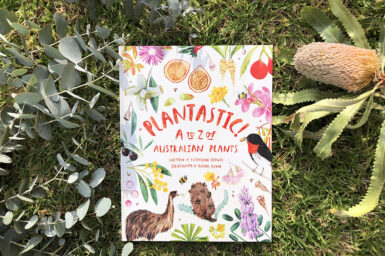 Copy of Plantastic! book on grass, surround be leaves and banksia flower