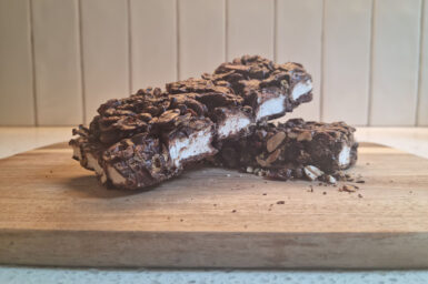 Two pieces of delicious rocky road artfully stacked on top of one another.